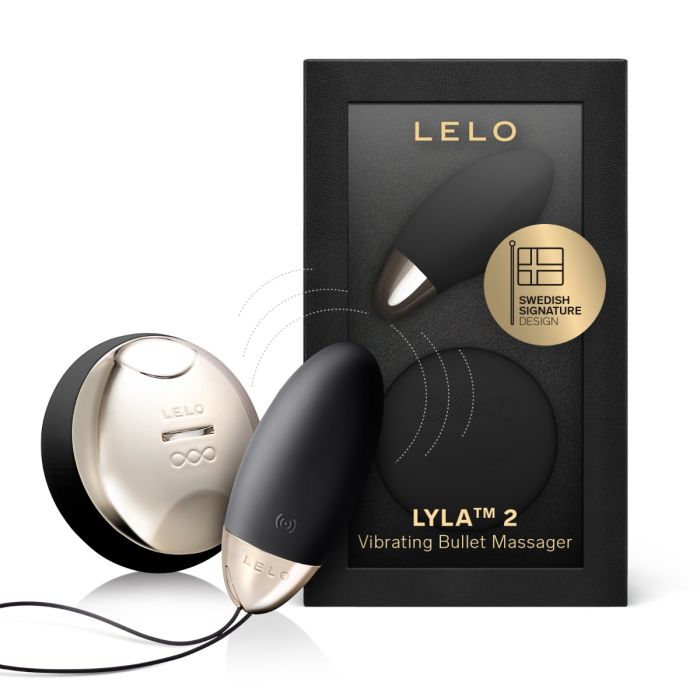 LELO Lyla 2 vibrating bullet massager in black with wireless remote standing next to its retail box.