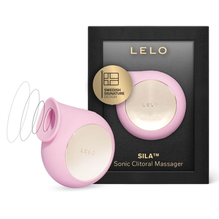 Pink LELO Sila Sonic Clitoral Massager standing beside its black retail box featuring a gold Swedish design seal.
