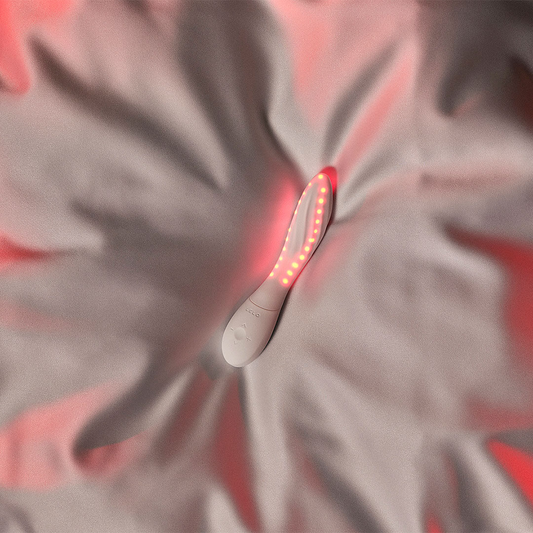 LELO MONA Spectra campaign banner featuring a lifestyle model shot alongside the red light intimate wellness massager.
